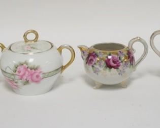1273	2 HAND PAINTED CREAMER & SUGAR SETS, ONE IS THOMAS
