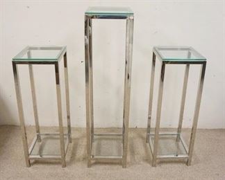 1289	3 MODERN CHROME & GLASS PEDESTALS, ALL ARE 12 IN SQUARE, TALLEST IS 48 IN HIGH, OTHERS ARE 36 IN HIGH
