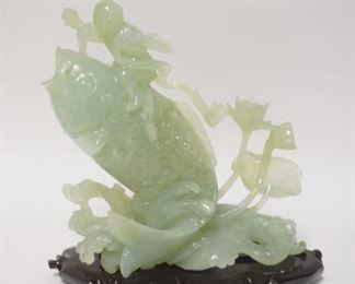 1311	ASIAN SCULPTURE MAN ON A FISH, WOODEN BASE, 9 1/4 IN WIDE X 9 3/4 IN HIGH
