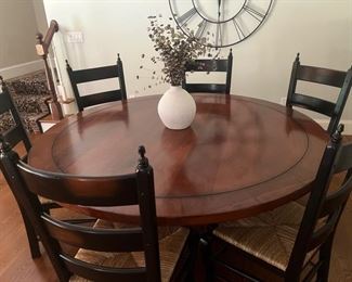 Magnificent 72" round dining room table with 8 matching chairs. Hand finished, polished solid hardwood. $995.00