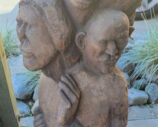 Abstracted wood sculpture. About 40" tall.