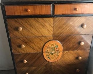 Tall Dresser with 6 drawers 
Hand floral stencil decorations circa 1930
Measures 49”(l) and 35”(w)
Legs with wheels for ease 
