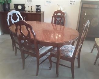 Bassett Dining Room with 6 chairs measures 55" (l) and with extra leaf measures 68" total in length