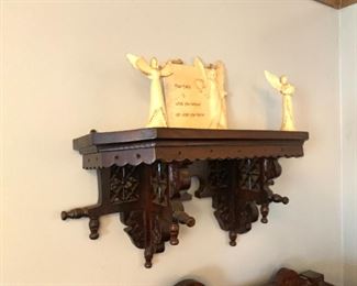 elaborately carved shelf