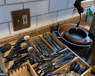 Silverware, copper cookware, knives