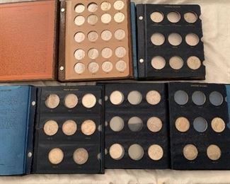 Books of Morgan dollars, peace dollars, and Kennedy dollars