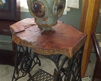 Cast iron sewing machine table with antique railroad Lantern