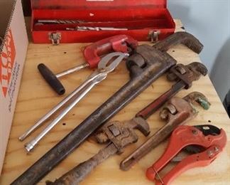 Pipe wrenches and plumbing supplies