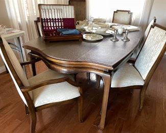 Clean and beautifully detailed solid wood dining set with 6 chairs, 2 leaves, custom pads.