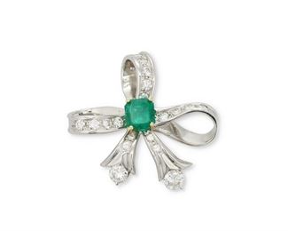 1002
A Moboco Emerald And Diamond Ribbon Brooch
Platinum and 18k yellow gold, stamped: Moboco
Centering a rectangular-cut emerald gauged at approximately 2.55cts., further set with two full-cut round diamonds, totaling approximately 1.25cts, and nineteen full-cut round diamonds, totaling approximately 1.2cts and graded F-G color and VS clarity
2" H x 1.75" W
25 grams
Estimate: $2,500 - $3,500