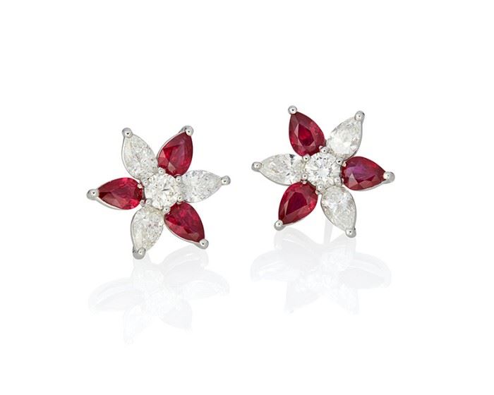 1001
A Pair Of Ruby And Diamond Flower Earrings
Platinum
Set with two round and six pear-shaped diamonds totaling 2.10cts. and graded F-G color and VS clarity and six pear-shaped rubies totaling 2.81cts., with post backs
0.50" Dia
7 grams
2 pieces
Estimate: $6,000 - $8,000