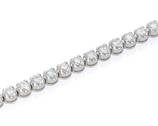 1003
A Diamond Bracelet
18k white gold
Set with thirty-five full-cut round diamonds totaling 7.07cts. and graded H-I color and VS clarity
6.75"
18.5 grams
Estimate: $8,000 - $12,000