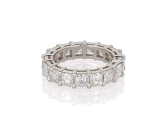 1004
A Diamond Eternity Band
Platinum
Set with seventeen square-cut diamond, totaling 5.78cts and graded F-G color and VS clarity
Ring size: 6.5
8.27 grams
Estimate: $10,000 - $15,000