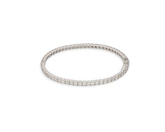 1008
A Diamond Bangle Bracelet
18k white gold
Entirely set with sixty full-cut round diamonds totaling 5.75cts., and graded G-H color and VS clarity
6.5" L
15.6 grams
Estimate: $6,000 - $8,000