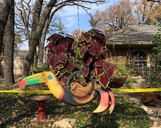 one of a kind! toucan planter made of a tire
