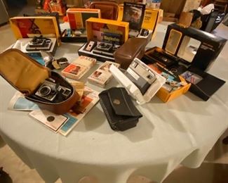 A Collection of Vintage Kodak Cameras in Original Boxes and Accessories