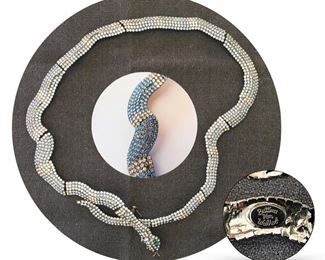 Rare early Bettina von Walhof snake/serpent necklace; alternating blue and white Sawrovski crystal "bands"; name in cartouche on back; designed using von Walhof's classic spring mechanism