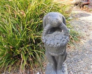 Concrete Dog Statue holding basket of Daisies