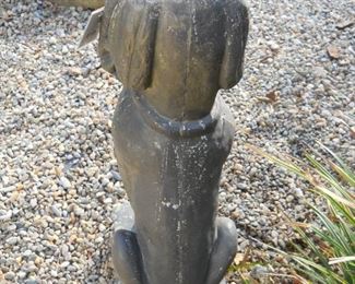 Concrete Dog Statue holding basket of Daisies