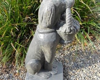 Concrete Dog Statue holding basket of Daisies