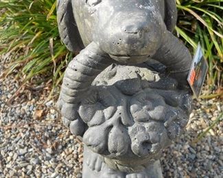 Concrete Dog Statue holding basket of Daisies