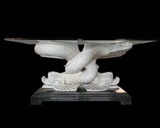 $850     

INTERTWINED SERPENT OCCASIONAL TABLE WITH GLASS TOP ATTRIBUTED TO MAITLAND SMITH
 
DRAMA! Every room can use 1 piece that adds drama.  With a perfect combination of art + accent table this piece brings functional art to your living space.  The drama of the sculpted serpent art and the contrast of color make a statement that remains a great choice for many different design aesthetics. 
 
DETAILS + DIMENSIONS:

Glass top console table.
Bone-colored carved intertwined fish.
Graduated faux marble painted black base.
Tempered Glass,
Lacquered Wood
Regency Style
Neoclassical Style
Height: 30.75 inches / 78.11 cm
Width: 67.75 inches / 172.09 cm
Depth: 26 inches / 66.04 cm 
Condition:  This piece is an authentic vintage piece that show wear commensurate of age and use.  There are minor superficial marks though nothing that stands out. Please refer to photo's for a more detailed look at condition.  We make every attempt to list and photograph any defects or signs of wear that are sig