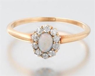 A Diminutive Opal and Diamond Ring 