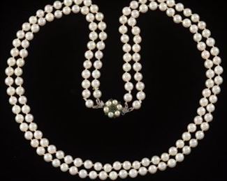 A Double Strand of Pearl and Gemstone Clasp Necklace 