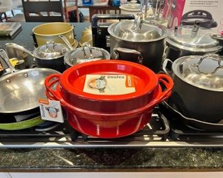 Le Creuset and various other pots and pans