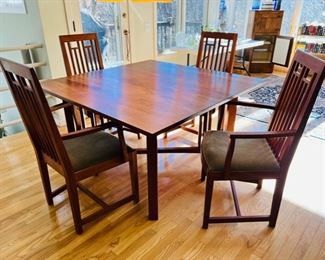 Thomas Moser cherry dining set with Knoll loden green mohair upholstered seats.  Each piece of this dining set is signed and dated 2001.  There are two 22” leaves with individual carrying cases and six arm chairs.  Table without leaves is a 52” square