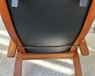 The “Lolling” Chair and coordinating ottoman by Thomas Moser, signed and dated 2001