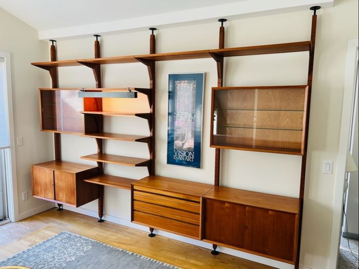 Stunning Danish Modern Poul Cadovius for Cado tension pole four bay wall unit.  This piece is capable of being used as a room divider as there are stay pin holes on the front and back of the tension poles.  As pictured, 130”W x 94”T x 18”D