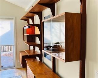 Stunning Danish Modern Poul Cadovius for Cado tension pole four bay wall unit.  This piece is capable of being used as a room divider as there are stay pin holes on the front and back of the tension poles.  As pictured, 130”W x 94”T x 18”D