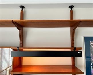 Stunning Danish Modern Poul Cadovius for Cado tension pole four bay wall unit.  This piece is capable of being used as a room divider as there are stay pin holes on the front and back of the tension poles.  As pictured, 130”W x 94”T x 18”D