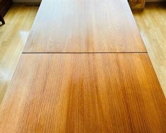 Unique Danish Modern Teak Drop Leaf Dining Table.  Goes from 47” long to 94” when the two 23 1/2” leaves are fully extended.  Overall width is 31 1/2”.