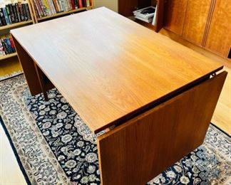 Unique Danish Modern Teak Drop Leaf Dining Table.  Goes from 47” long to 94” when the two 23 1/2” leaves are fully extended.  Overall width is 31 1/2”.