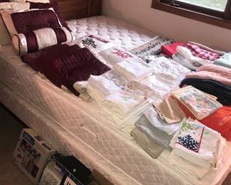 Queen size bed and queen size bed frame keyboard linens pillows kitchen towels embroidered pillowcases