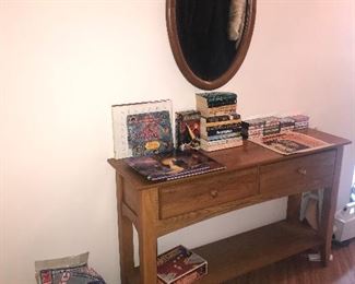 Hall table, entry table, sofa table, vacuum bags, books