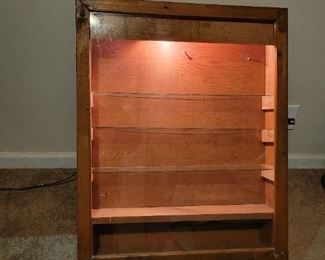 lighted wood Storage cabinet with lock latch 34 inches height, 2 feet across,5 inches deep