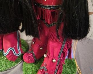 Locally made Porcelain Handmade Native American dolls on stands.