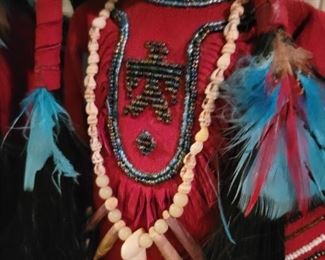 Locally made Porcelain Handmade Native American dolls on stands.