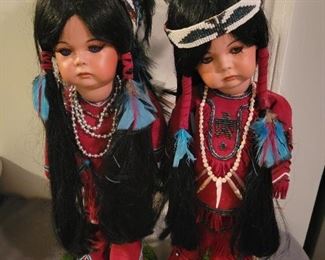 Locally made Porcelain Handmade Native American dolls on stands.