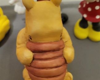 Disney pieces including Mickey and Minnie and a classic Pooh by Charpente 