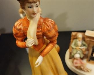 Porcelain figures including "Gorham Lady Taking a Trip" and Avon ladies thimbles, American Remembers Family Reads aloud