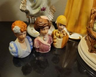 Porcelain figures including "Gorham Lady Taking a Trip" and Avon ladies thimbles, American Remembers Family Reads aloud