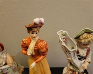 Porcelain figures including "Gorham Lady Taking a Trip" and Avon ladies thimbles, American Remembers Family Reads aloud