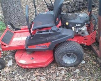 42 inch cut Simplicity zero turn mower with Briggs and Stratton motor, need a tune-up and new blades plus has some damage to plastic to right side plastic on cup holder