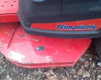 42 inch cut Simplicity zero turn mower with Briggs and Stratton motor, need a tune-up and new blades plus has some damage to plastic to right side plastic on cup holder