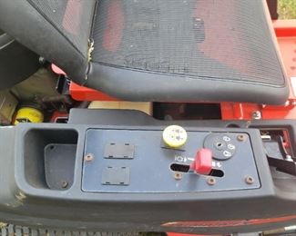 42 inch cut Simplicity zero turn mower with Briggs and Stratton motor, need a tune-up and new blades plus has some damage to plastic to right side plastic on cup holder