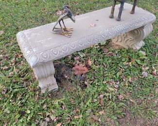 Concrete bench and yard art